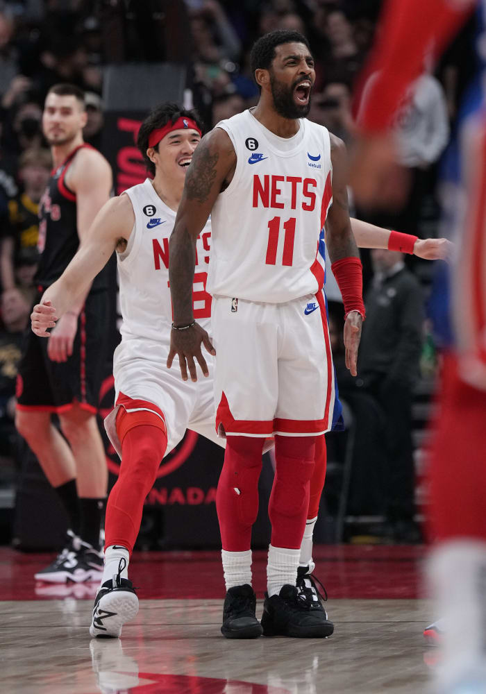 Kyrie Irving celebrates a game-winning shot.
